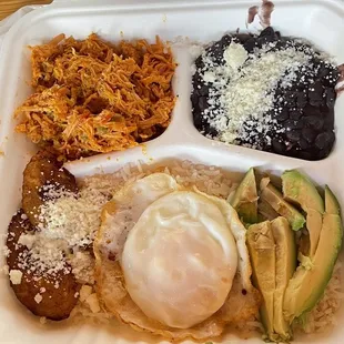 Shredded chicken, black beans, fried plantains, eggs and avo over rice! Soooooo yummy!