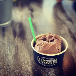 a cup of ice cream on a table