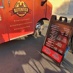 a sign outside of a food truck