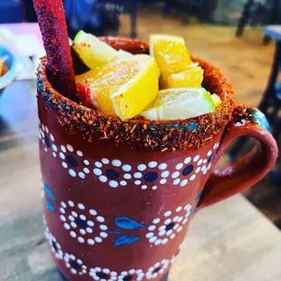 a bloody mug filled with fruit