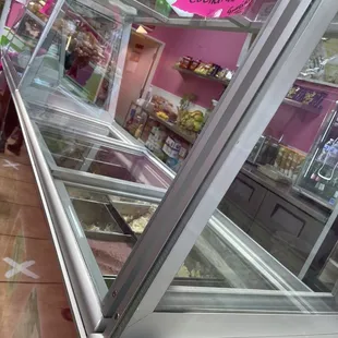 a display case with a variety of pastries