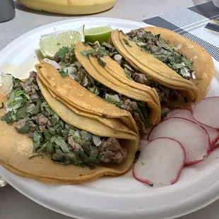 three tacos on a plate