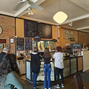 a group of people in a cafe