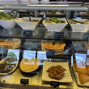 Salad, Tabouli, Penne Florentine, Kale Quinoa, Spinach and Tomato Quiche, Dolmades, &amp; Hummus.