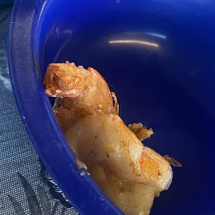 a shrimp in a blue bowl