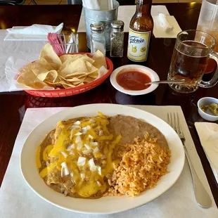 3 beef enchiladas with rice and refried beans. Chips and salsa aVictoria beer and iced tea.