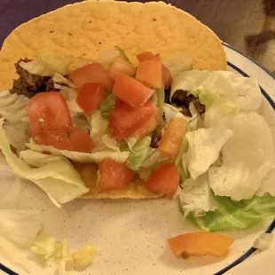 Crispy beef taco. Fresh made taco shell and the best ground beef ever! Greatness