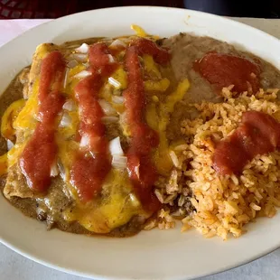 3 beef enchiladas with rice and refried beans with salsa added.