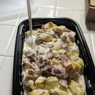 Tortellini with cheese with heavy whipping cream and Ham
