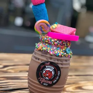 a chocolate drink with sprinkles and candy
