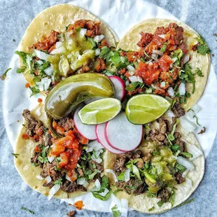 2 Beef and 2 pork tacos. Hot sauce on 2, mild on 2.