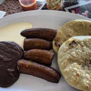 Pupusas Chicharron and Mixed with Plantains, Beans and Cream.