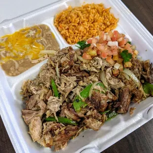 Carnitas plate served with rice, beans and tortillas
Get while it&apos;s hot!