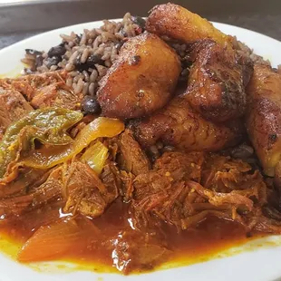 Ropa vieja with plantains, black beans and rice