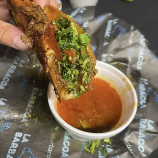 Quesataco de barbacoa with consommé