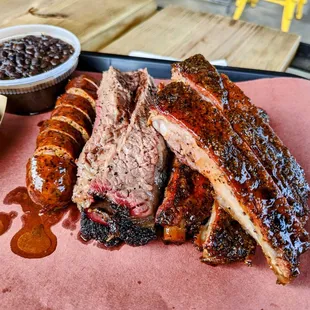 Ribs, brisket, sausage, potato salad, and black beans