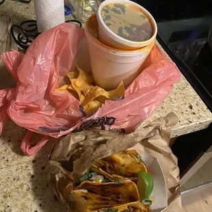 a bowl of chips and a cup of soup