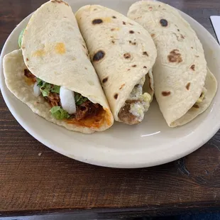 Cabrito, chicharron con huevos, machacado from left to right