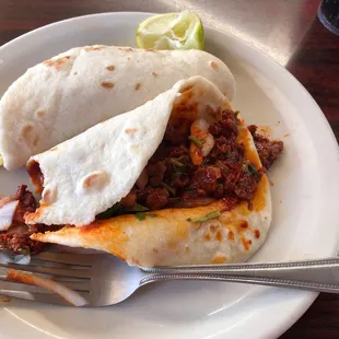 Taco al pastor and huevos con papas