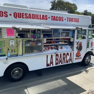 a food truck parked on the side of the road