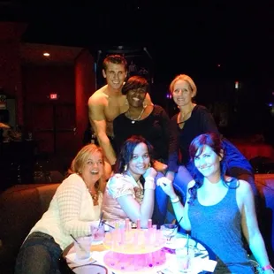 a group of people sitting around a table