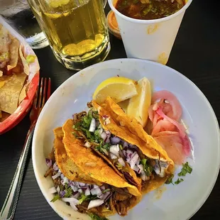 Birra tacos and dipping liquid