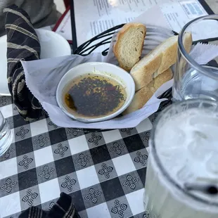 House bread and olive oil with fresh herbs