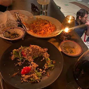 a plate of food and a glass of wine