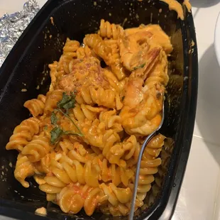 a bowl of pasta with shrimp