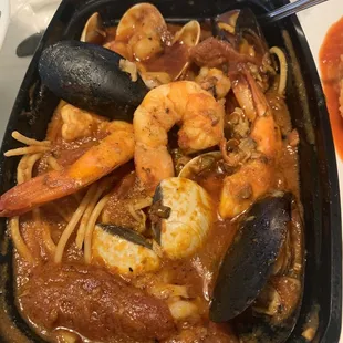 a bowl of seafood and pasta