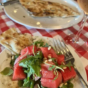 Focaccia and half a serving of watermelon salad.