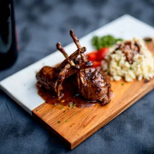 a plate of food and a bottle of wine