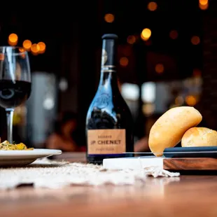 a plate of food and a bottle of wine