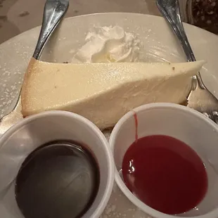 Home made cheesecake with chocolate and raspberry sauce