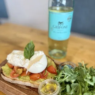 a plate of food and a bottle of wine