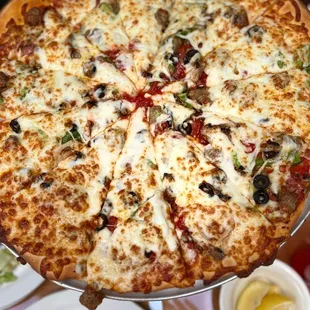 a pizza with cheese and olives