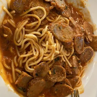 a plate of spaghetti and meat