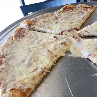 a cheese pizza on a pan