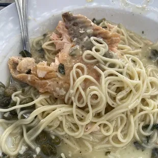 Half eatin salmon piccata, very delicious