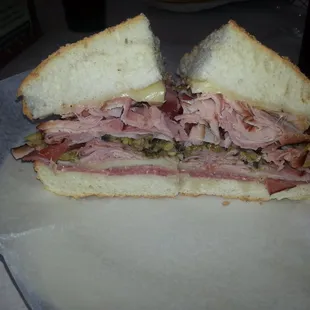 Muffuletta half...this is ridiculous the flavor is great, olive dressing is perfect