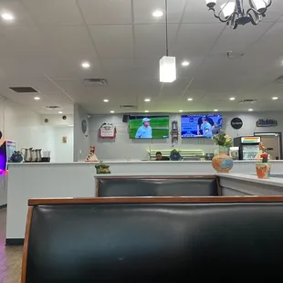 Tall booths and a little bar in the back.