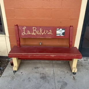 Bench out in front of restaurant.