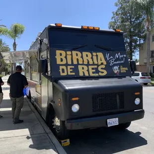 a food truck parked on the side of the road
