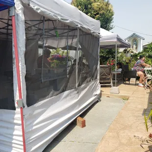 a tent with a table and chairs