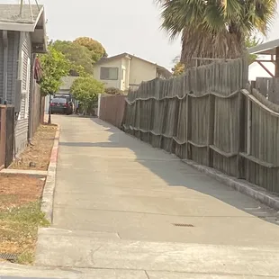 The drive way to enter, and is located way back.