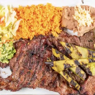 El PISTOLERO Steak Dinner: The gunslinger plate fuels your mission with a hearty carne asada [steak] so good, fingers will be licked.