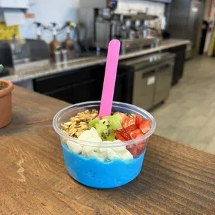 Regular blue cream açaí bowl with strawberry, granola, kiwi, and mochi.