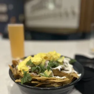 Chilaquiles verdes and guava seltzer