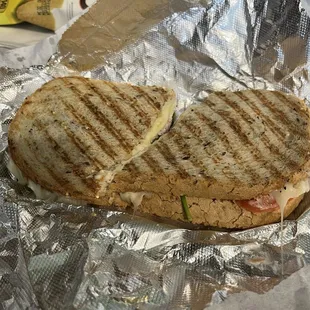 63. Grilled Swiss, Mozzarella, Provolone, Tomato, Onion, Spinach, Pesto Mayo, Wheat