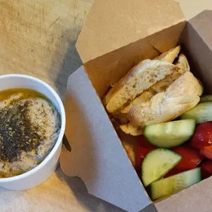 This white bean hummus!! Olive oil, lemon, sumac za'atar, roasted garlic, Aleppo pepper. Dippers: cucumber, bell pepper, bread. $8